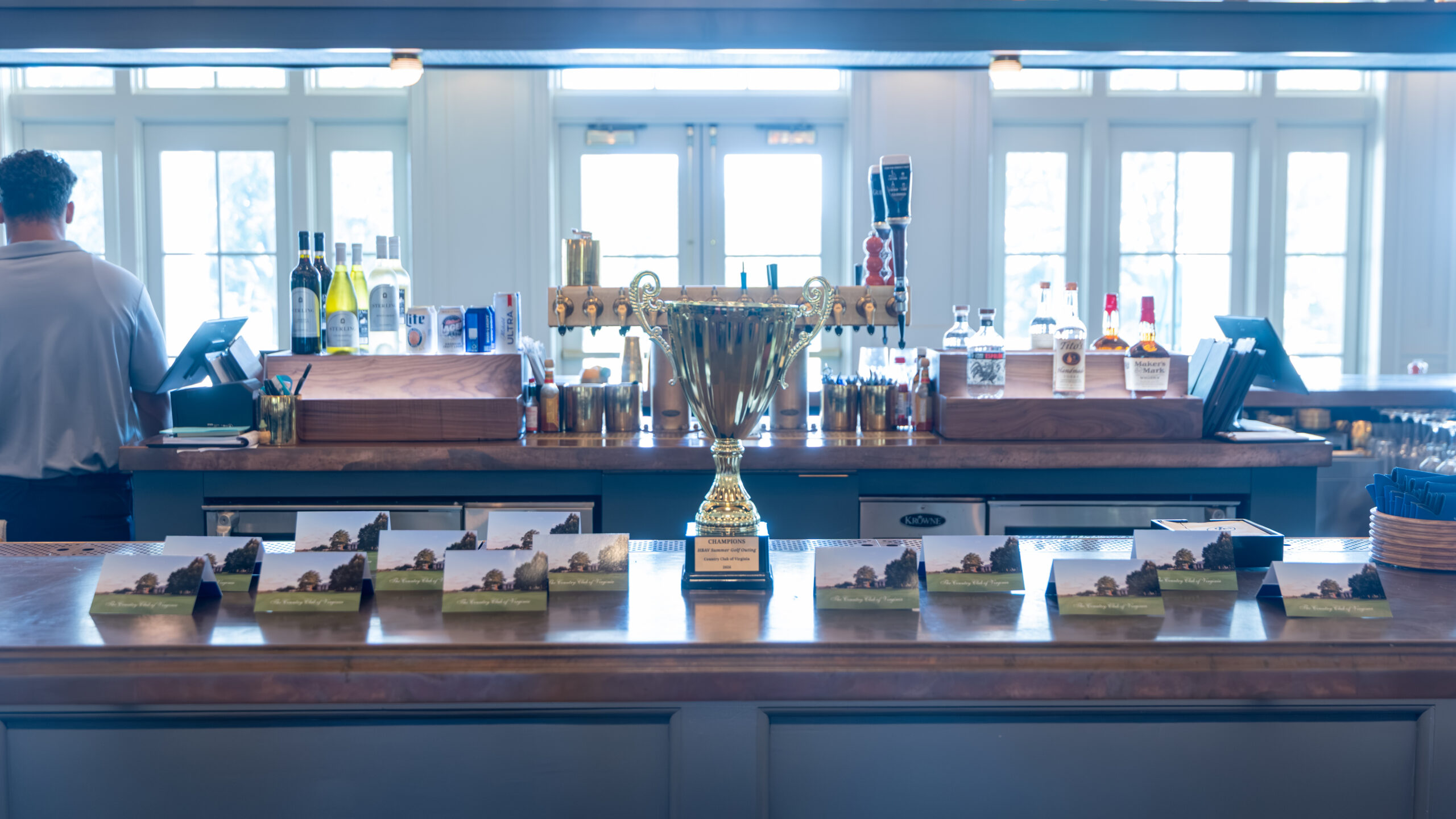 A bar with a large gold trophy